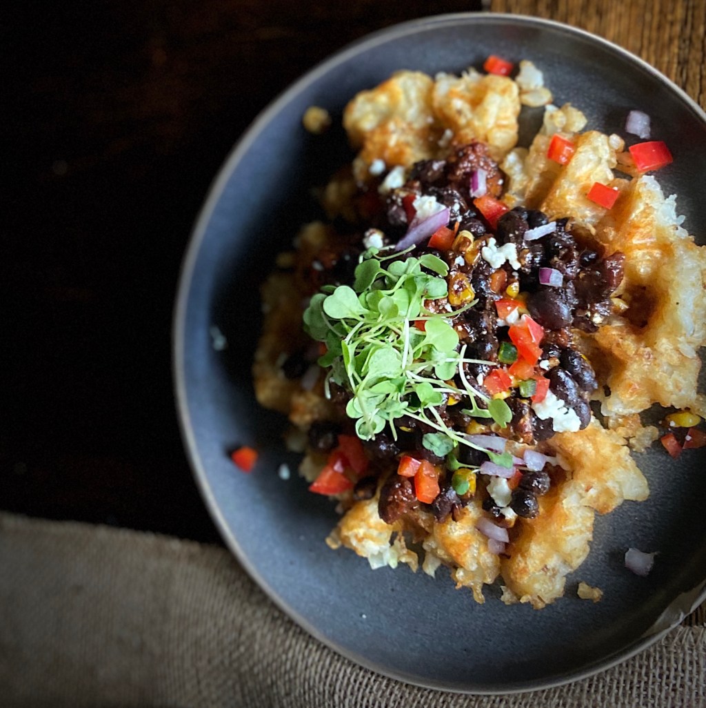 Spicy Mexican Beans, Corn,Vegan Mexican Sausage and Fresco on a Tater Tot Waffle –&nbsp;Yes!